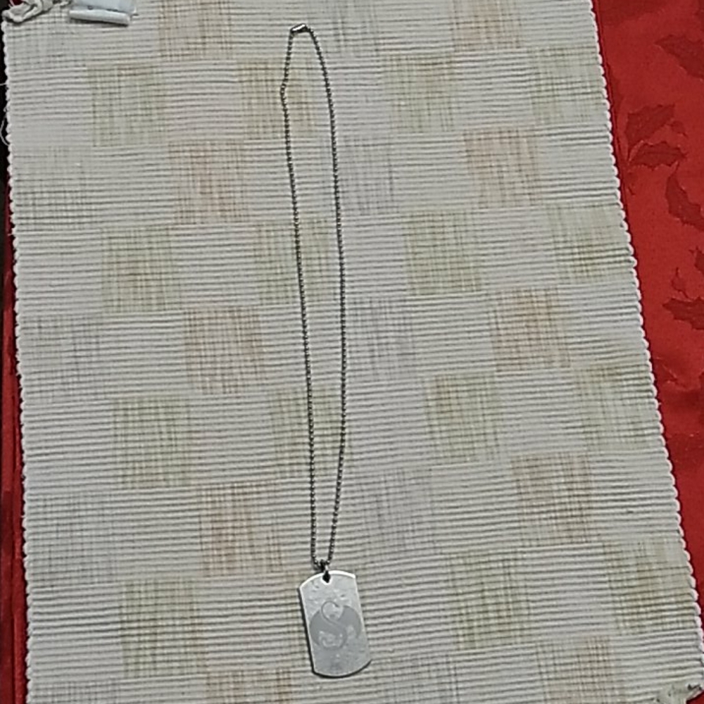 Strange Music logo symbol dogtag